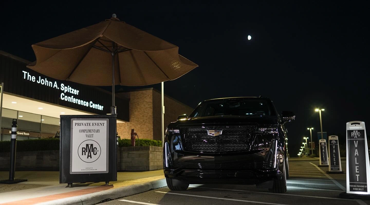 RCMA Valet provides top-tier valet services at the John A. Spitzer Conference Center, ensuring guests arrive and depart with ease and elegance. This image features our valet booth and a luxury vehicle, showcasing the professionalism and reliability that RCMA Valet brings to every event. As a premier valet company in Cleveland, we specialize in valet parking for conferences, private events, and high-profile gatherings, enhancing guest experience from start to finish.     